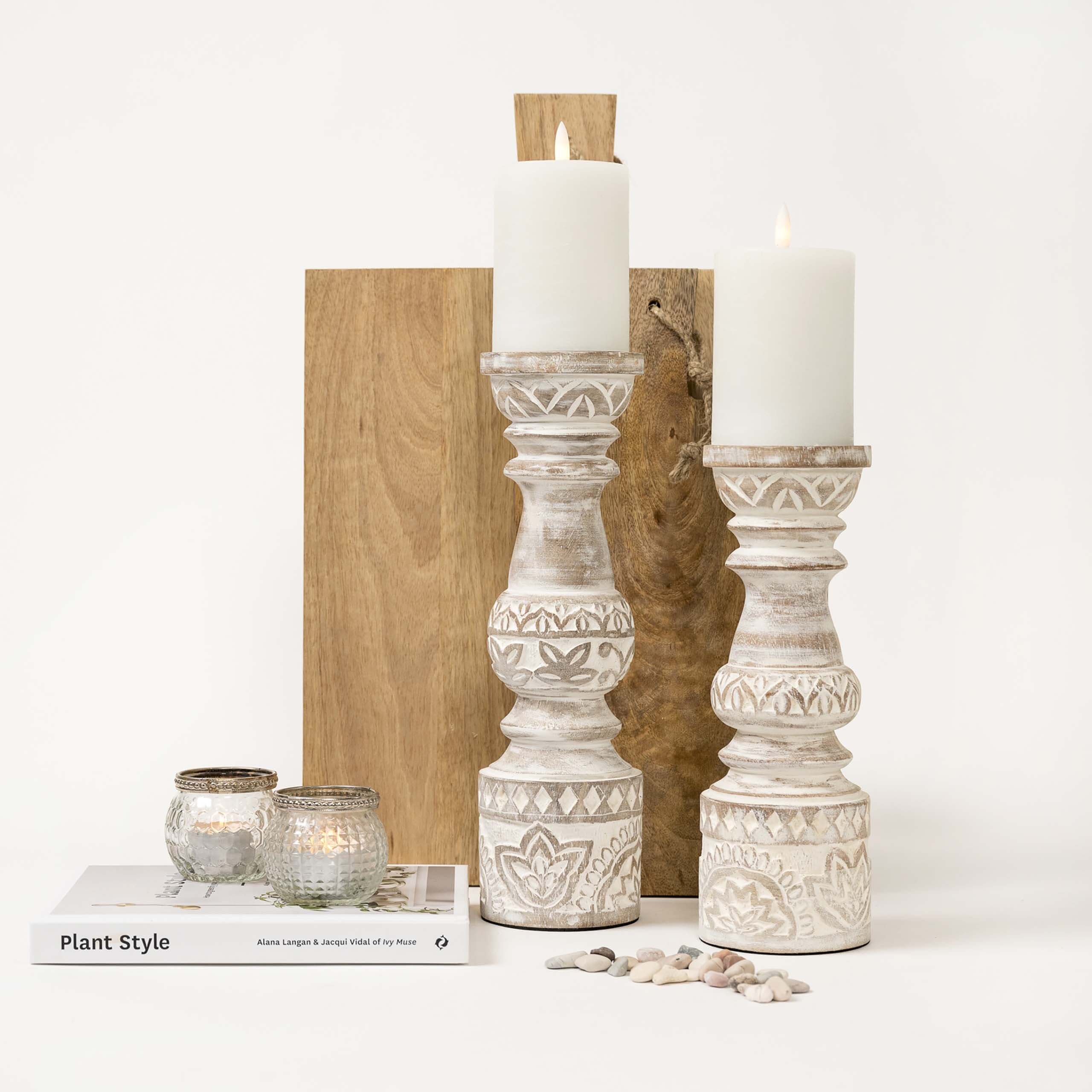 Tall white washed candle stands